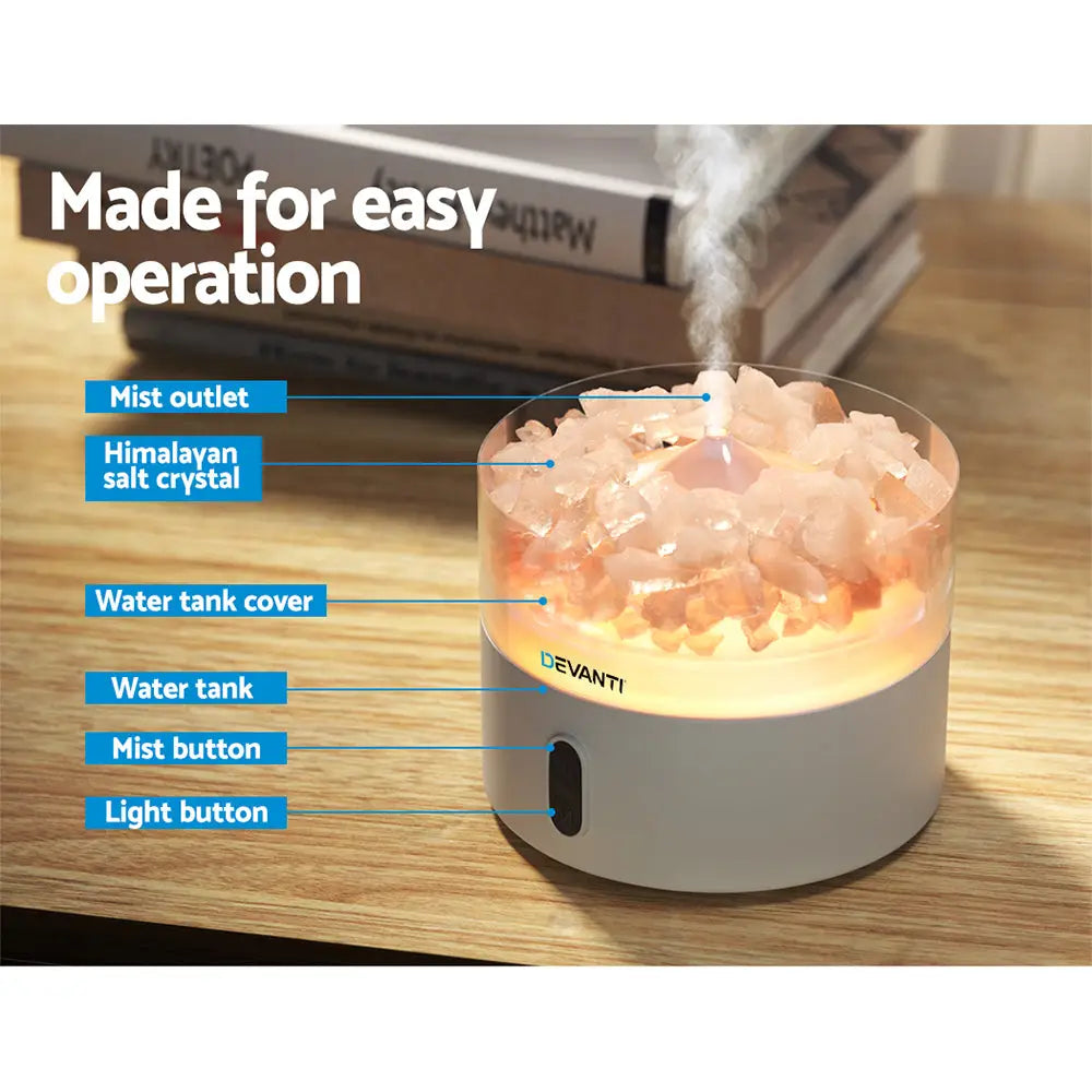 Devanti pink Crystals on white base Humidifier sitting on timber table with blue writing instructions.
