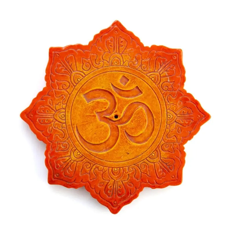 Lotus-shaped incense burner featuring spiritual symbol 'om' surrounded by intricate carved details
With vibrant orange colouring with stone texture on white background