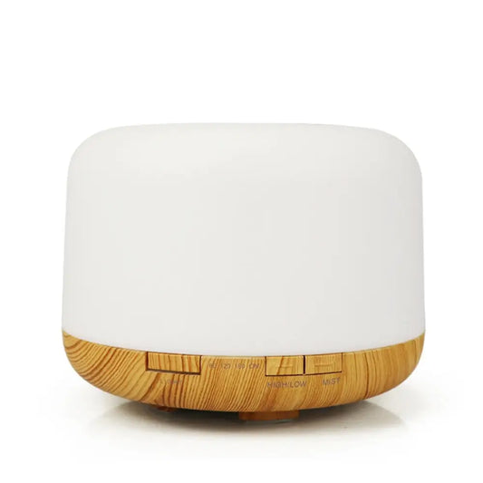 5 in 1 round white with light wood base aroma diffuser on white background.