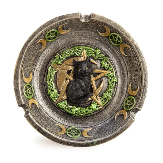 shallow rustic copper incense dish with a black cat and gold  crescent and pentacle and green leaves in the centre.