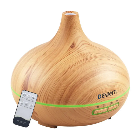 Devanti 4 in 1 aroma diffuser light wood colour with small remote on white background.