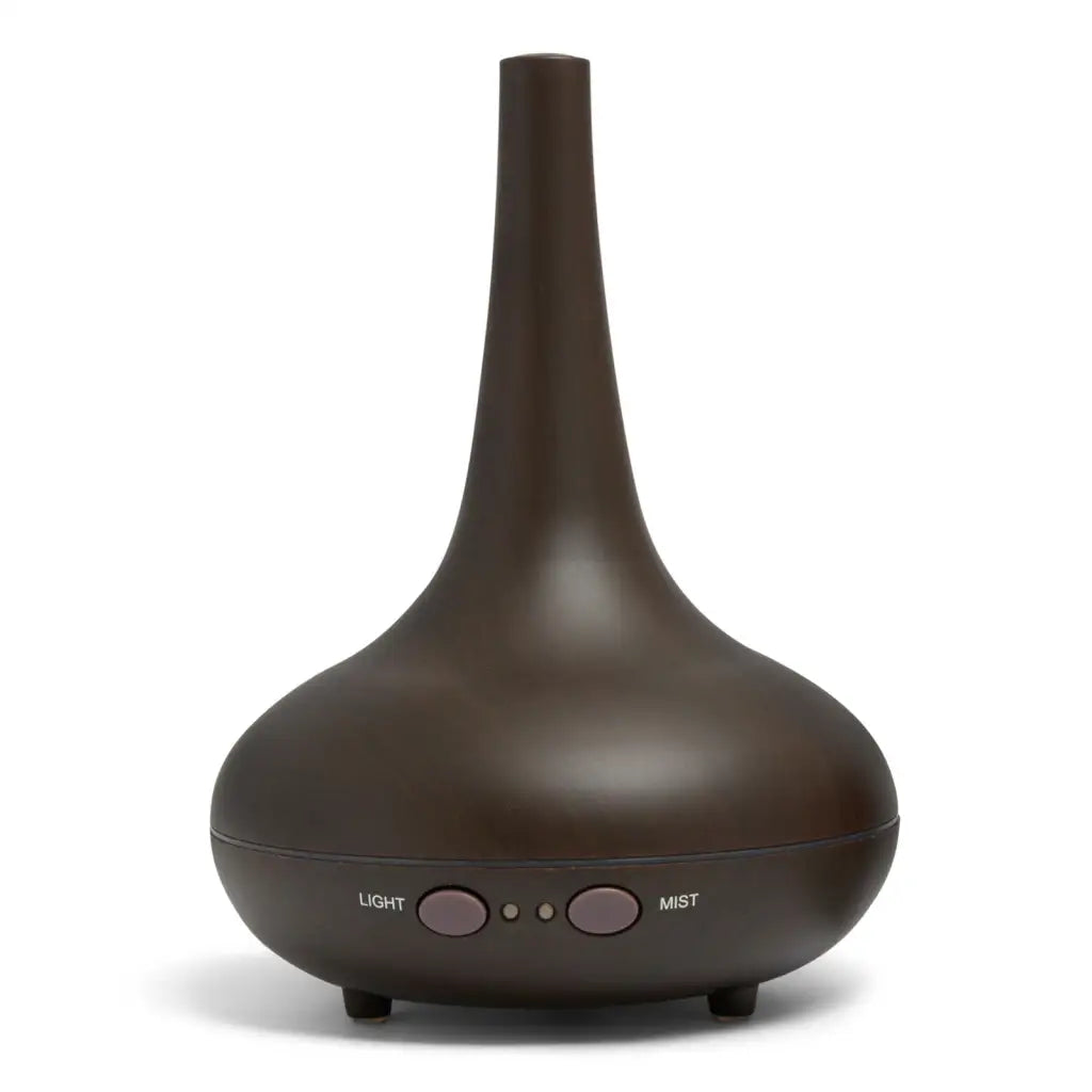 Essential dark wood genie shape Oil Diffuser with white background.