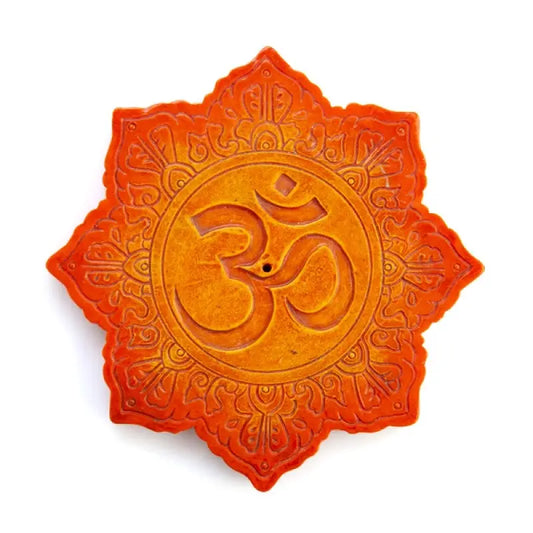 Lotus-shaped incense burner featuring spiritual symbol 'om' surrounded by intricate carved details
With vibrant orange colouring with stone texture on white background


