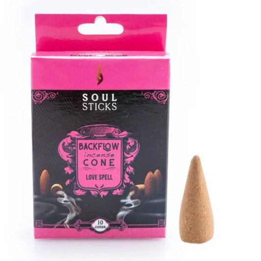 Backflow incense cone in scent labelled loved spell in pink box with singular cone next to it on white background